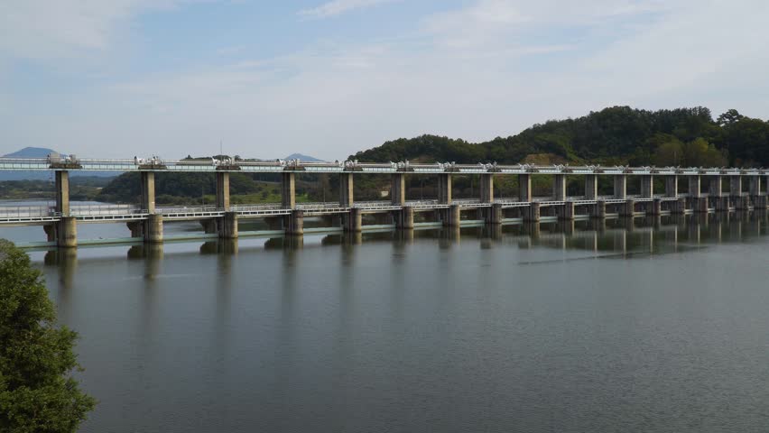 Panning shots of dams and lakes around the Namhan River and Chungju Lake
