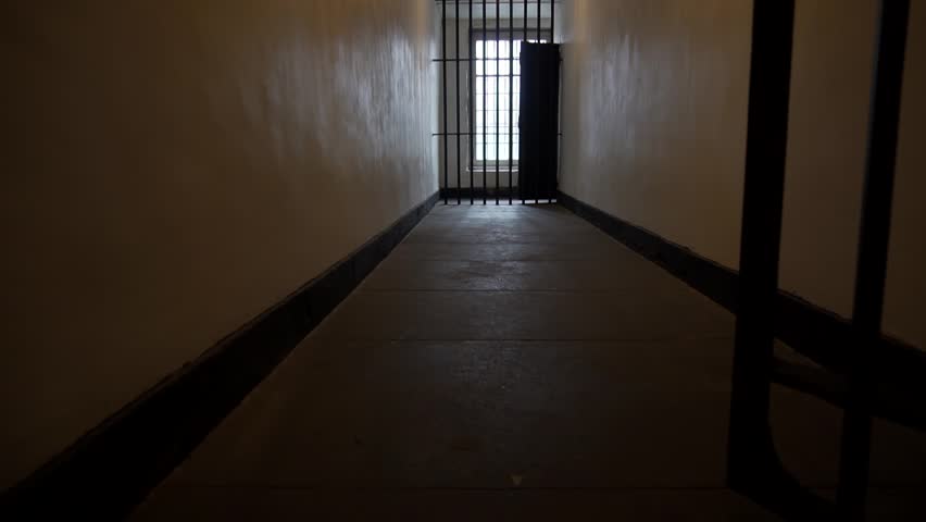 Prison Bars Close in a Dark, Depressing Jail Cell, Solitary Confinement Royalty-Free Stock Footage #32022991