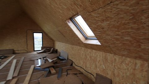 Attic while building with building materials, slide from left to right