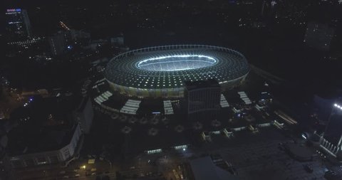 aerial survey. Kiev-Olympic Stadium October 9, 2017. World Cup. Ukraine-Croatia. cityscape time of day night. The view from the top to the illuminated stadium with games and fans.

