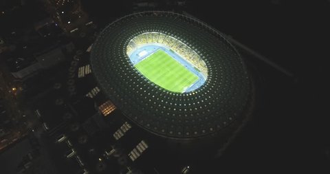 aerial survey. Kiev-Olympic Stadium October 9, 2017. World Cup. Ukraine-Croatia. cityscape time of day night. The view from the top to the illuminated stadium with games and fans.