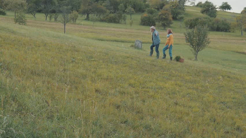 Senior couple with grandaughter in nature.