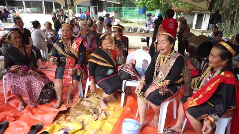 Tuaran Sabah Malaysia - Oct 21, 2017: Tantagas or priests of Lotud tribe performing a cleansing ritual called Mamahui Pogun meant to heal the world of its adversity caused by the unholy act of incest.