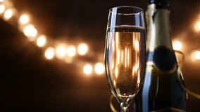 Toasting Champagne with holiday Bokeh Blinking Background. 4k footage