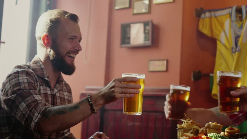 Good old friends drinking beer in pub | Shutterstock HD Video #32042011