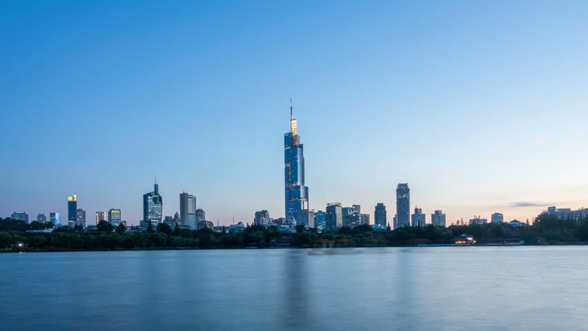 Time lapse of xuanwu lake with nanjing city skyline,from day to night landmark,china

