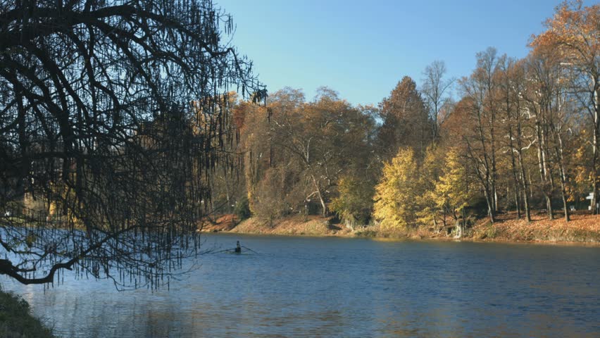 Turin in autumn along the Po river with rowers training. The city hosted the XX Winter Olympic Games in 2006