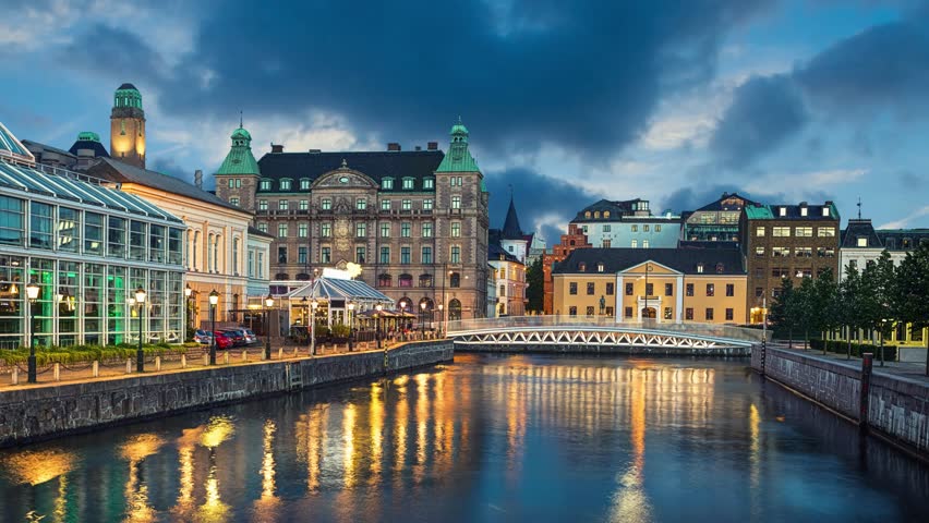 Malmo skyline from canal in the evening, Sweden (static image with animated sky and water)
