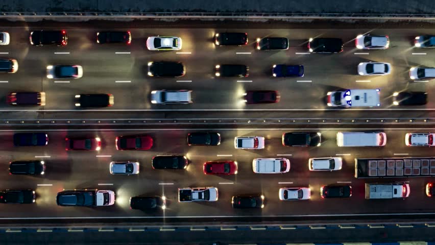 Freeway traffic jam city rush hour. Aerial night view time lapse city traffic