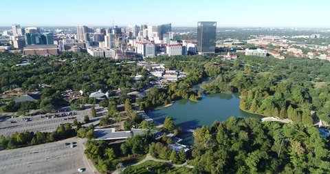 High quality 4k video footage of aerial view in Herman Park, Houston zoo and Medical center at Downtown Houston, Texas
