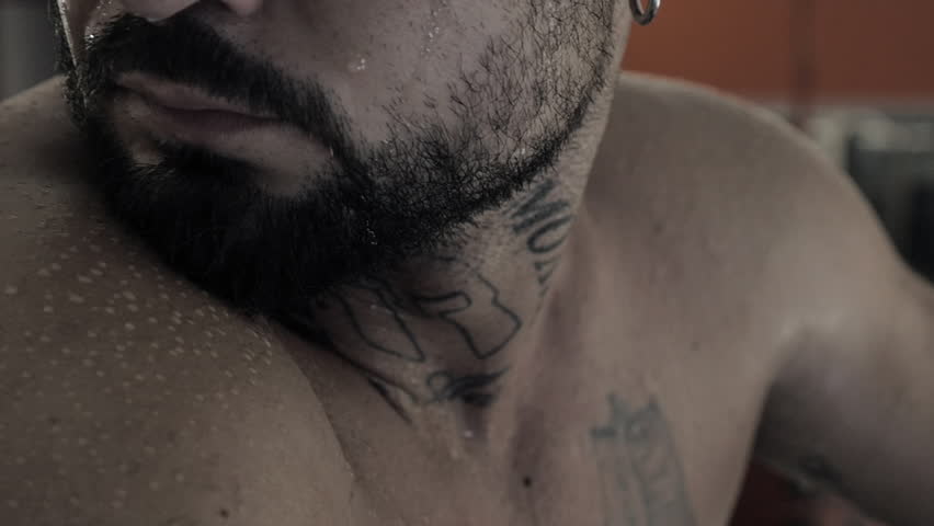 Boxer sweating after training smiling a little slow motion