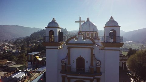Aerial view of de las Casa San Cristobal in Mexico, flying above church tower bell