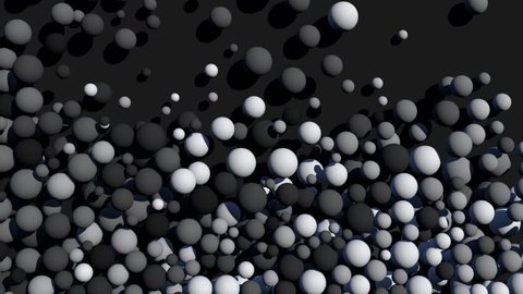 Стоковое видео: Falling grayscale spheres that fill the screen.