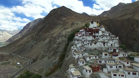 Aerial video in amazing landscape, with drone, over a Buddhist Monastery in a beautiful valley with sunny day.
Aerial travel landscape.
Flying over a Buddhist Monastery. Himalaya, Ladakh, Tibet.