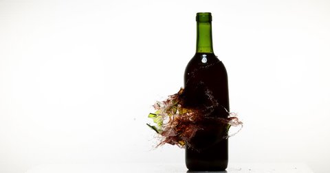 Bottle of Red Wine Breaking and Splashing against White Background, Slow motion 4K