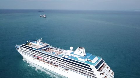 East Mediterranean - 23 Oct, 2017: Aerial view of luxury large cruise ship sails in full speed on open water, top down view of swimming pool and deck - the Nautica