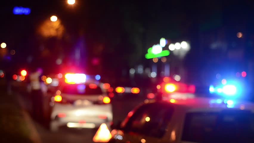 Blurred Police emergency lights flash at night. Car accident