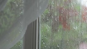 Hard rainy and raindrop on window frame interior view blur background