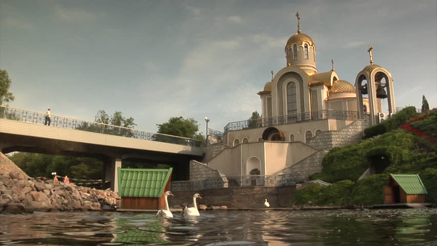 Swans in the lake. Church in Donetsk.
