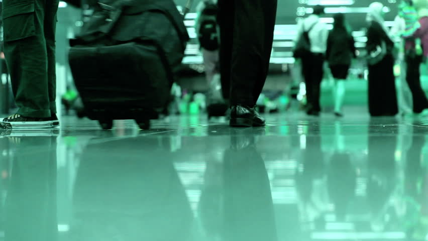 People legs walking in modern airport