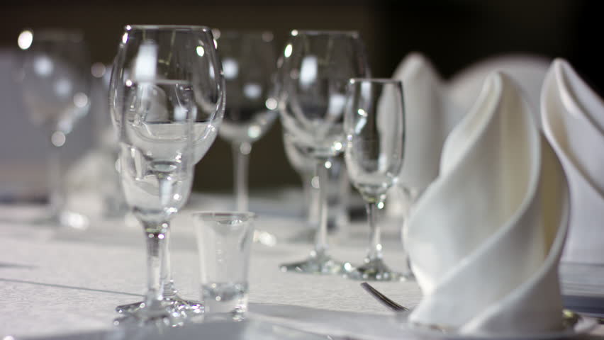 Shot of napkins and wine glasses banquet table at luxury restaurant | Shutterstock HD Video #32139133