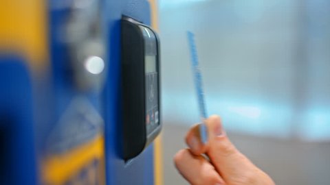 CloseUp of Paying by a Credit Card using Paypass Reader on a Ticket Vending Machine with Terminal