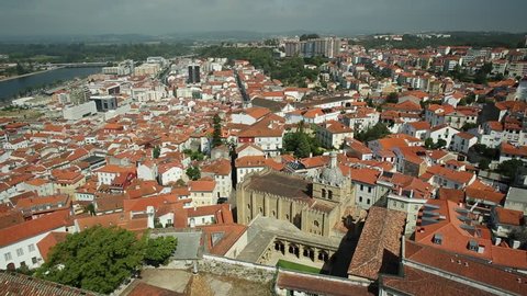 Coimbra panorama from top of bell Clock Tower. Old Coimbra Cathedral with dome and cloister. Se Velha de Coimbra, is one of most important romanesque buildings in Portugal and landmark in Coimbra.