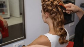 A woman having her haircut in hair studio