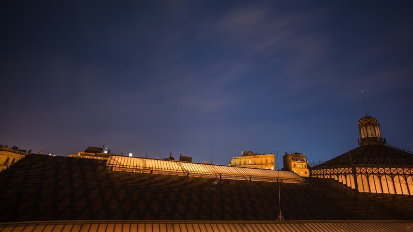 Rooftop of Born Market building illuminated at night