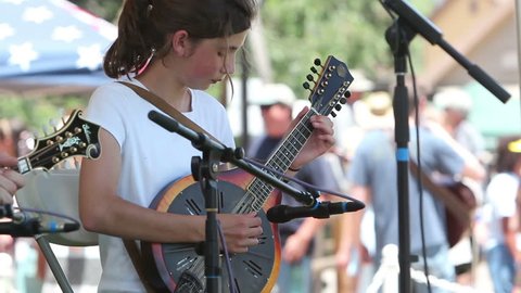 AGOURA HILLS, CA - MAY 20: Mandolin winner, Anya Sturm, 11, plays at the Topanga Banjo & Fiddle Festival in Agoura Hills on May 20, 2012. The long running festival is in its 52nd year.
