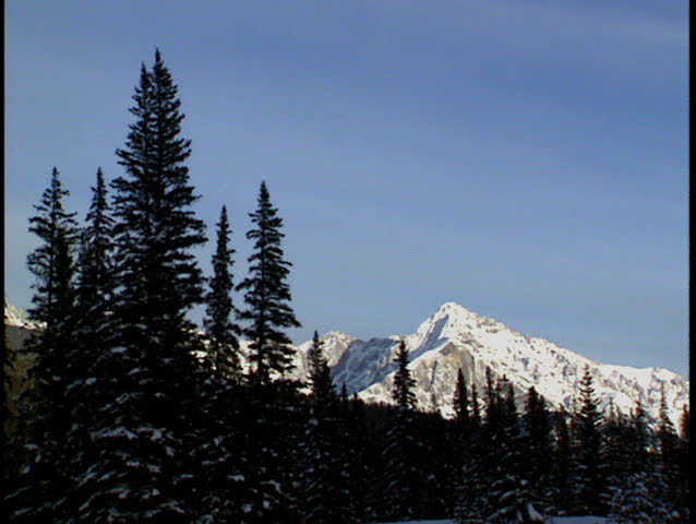 Zoom in to Mount Ishbel winter scene in Banff National Park Canada