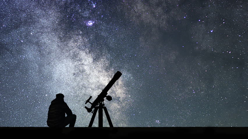 Man with astronomy telescope looking at the stars. Man telescope and starry sky. Night sky. Milky way galaxy Time Lapse.