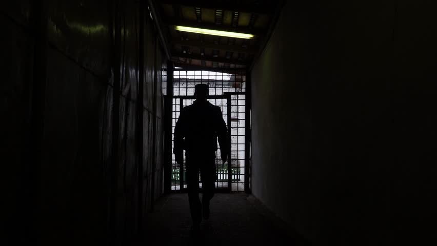 Prison officer walking in corridor in russian penitentiary colony, jail, prison at winter glidecam Royalty-Free Stock Footage #32168266