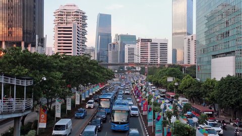 JAKARTA, INDONESIA - OCTOBER 22, 2017: Cars and buses stuck in a traffic jam in Jakarta business district during rush hour. Jakarta, Indonesia capital city is famous for being very congested. 