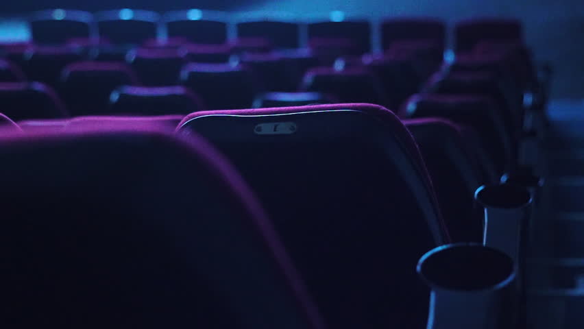 Empty red cinema or theater seats in dark | Shutterstock HD Video #32169550