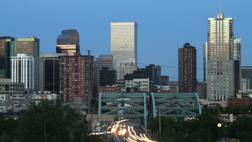 Downtown Denver, Colorado skyline with traffic at sunset. HD 1080p timelapse.