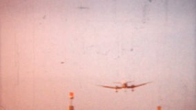 A shot of an airplane coming in for a landing in 1958 in Pennsylvania. 1958 Vintage 8mm film