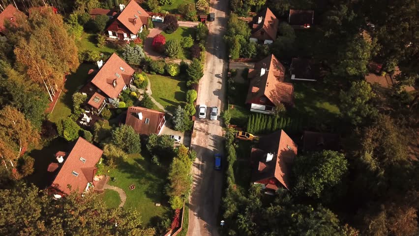 Aerial view of many different neighborhood houses that are in all sizes and shapes. 4K Royalty-Free Stock Footage #32185963
