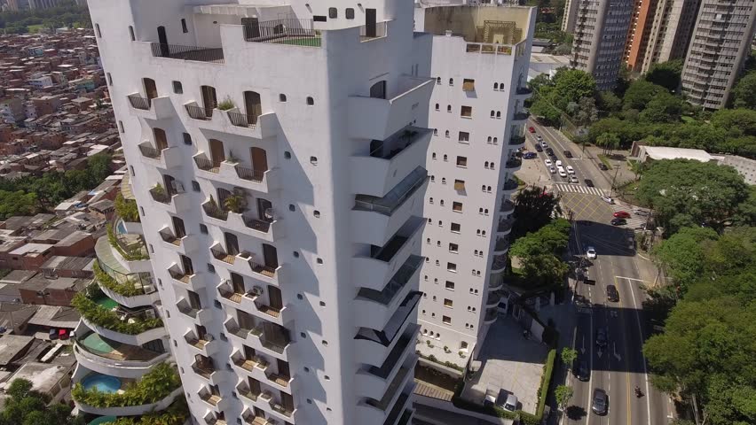Aerial view of luxury buildings and Paraisopolis favela, the biggest slum in São Paulo city, a social inequality icon in Brazil.