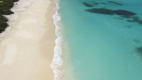 aerial view tropical lagoon, waves and sandy beach