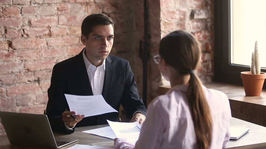 Businessman and businesswoman argue about documents, dissatisfied partners disagree with non-performance or bad collaboration result, canceling deal, breach of contract, noncompliance with obligation | Shutterstock HD Video #32239225