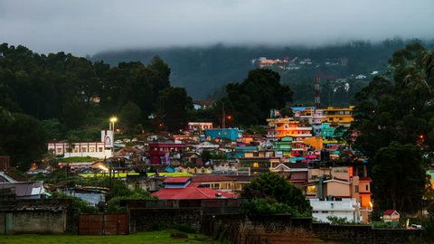 Ooty, India time-lapse from evening to night. Aerial view of Nilgiri mountain village in Tamil Nadu, India. Ooty is a popular resort with beautiful nature. Zoom in