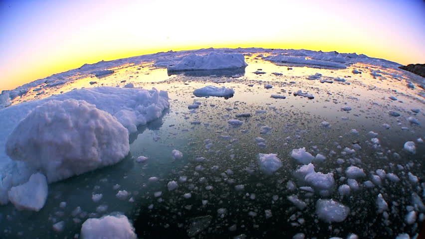 Sunset over floating arctic ice floes seen in wide angle Royalty-Free Stock Footage #3224299