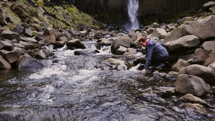 Woman near Svartifoss waterfall in Skaftafell National Park