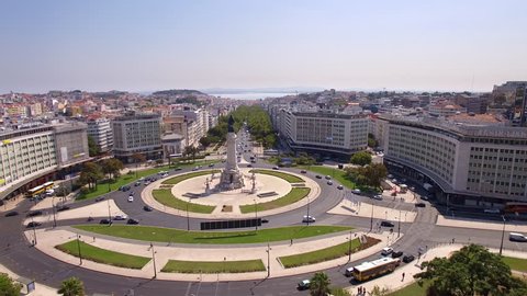 Lisbon, Portugal - September 19, 2017: Aerial view of traffic around Marques de Pombal Square during daytime in Lisbon, Portugal. 