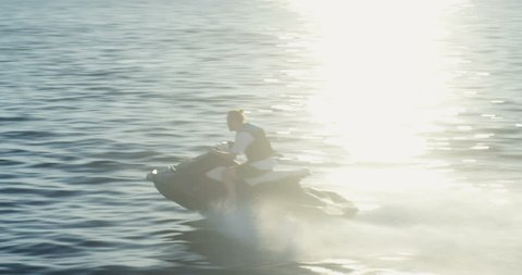 Following Shot of a Man on a Personal Water ?raft Driving Fast. Shot on RED Epic 4K UHD Camera.