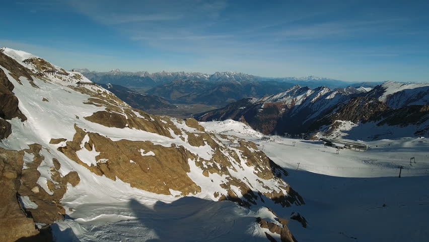 A breathtaking panorama of a ski slope atop the Alp mountains in Austria. Aerial shot. Drone Shot. 