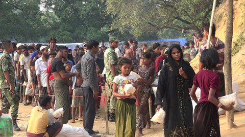 TEKNAF, BANGLADESH - OCTOBER 25, 2017: A busy unpaved dirt road in Katuapalong, the main Rohingya Refugee camp in Bangladesh