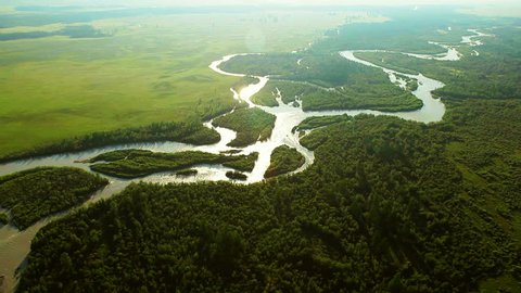 Aerial View. Flying over the beautiful mountain River. Aerial camera shot. Landscape panorama. Altai, Siberia.