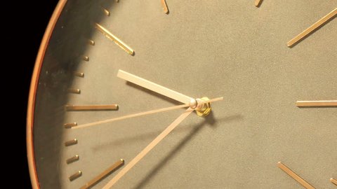 Modern Clock Face Fast Time Lapse. 
Wood and bronze modern clock ticking accelerated time.
Time flies moving fast forward in this time lapse.
Clock face running out in high speed.
